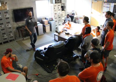 A CMM manager leading an AM Huddle