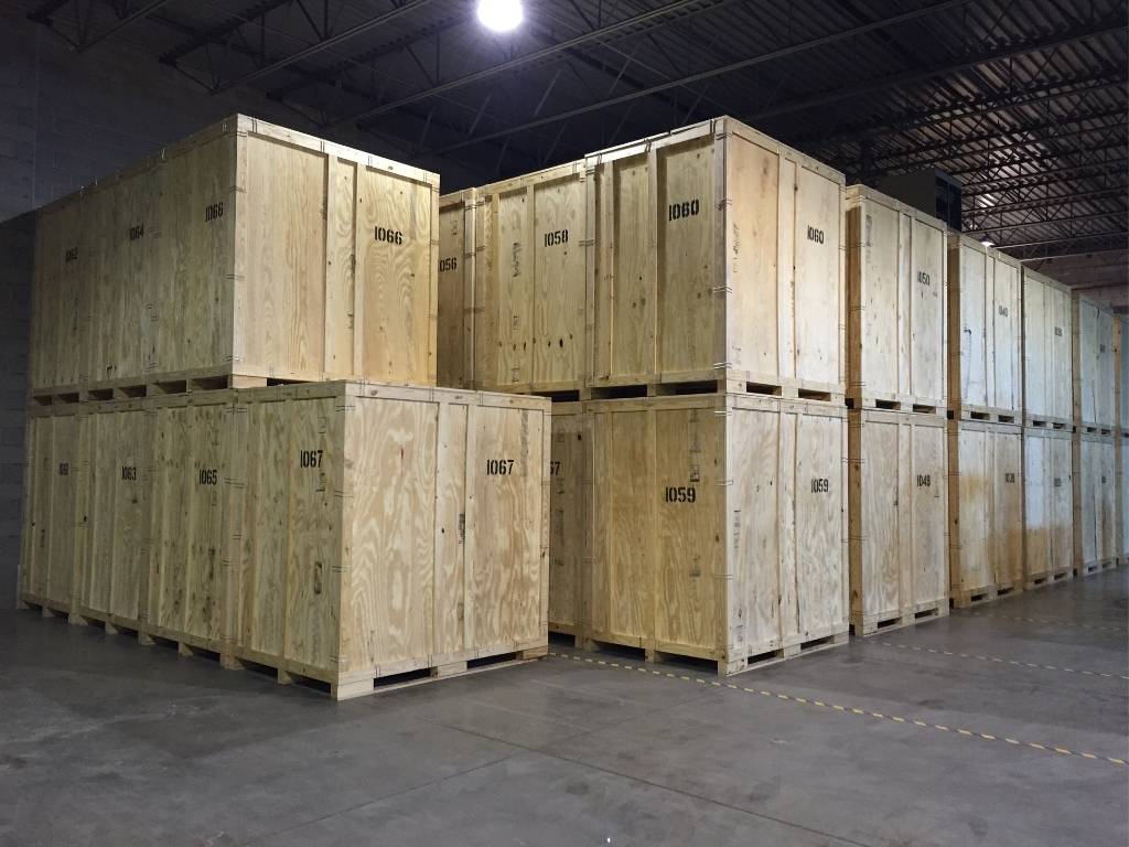 Rows of wooden storage vaults inside the College Muscle Movers warehouse in Saint Paul, MN